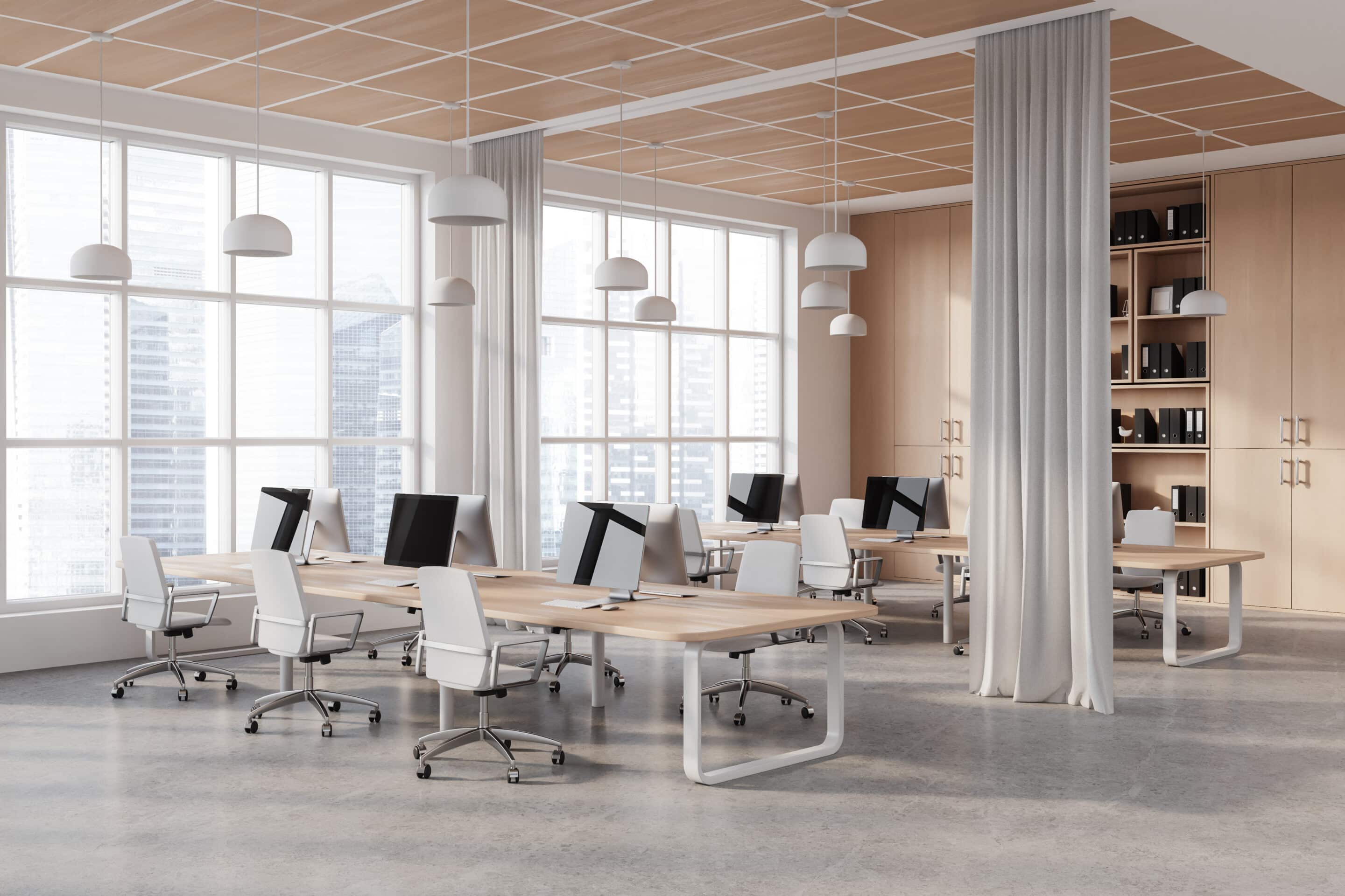 Corner of modern office with commercial drapery on windows and used as a room separator