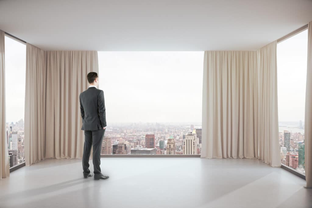 Man in commercial space with drapery