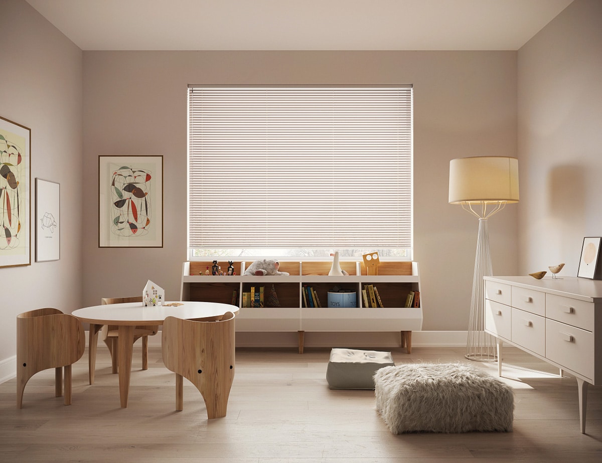 Aluminum blinds diffusing daylight into a playroom.